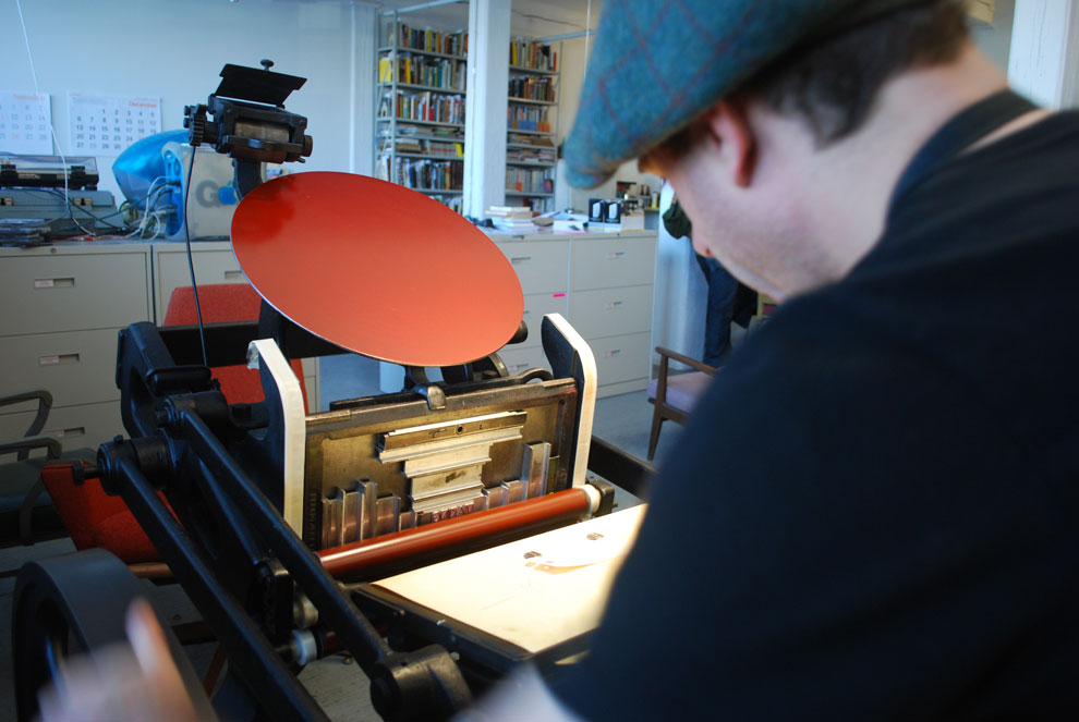 ben working on the chandler & price press, november 5, photographed by shannon miwa